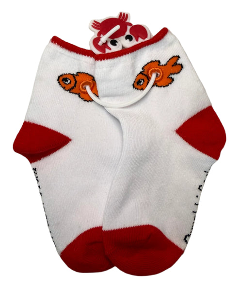 White sock with red accents and fish designs on a textured surface